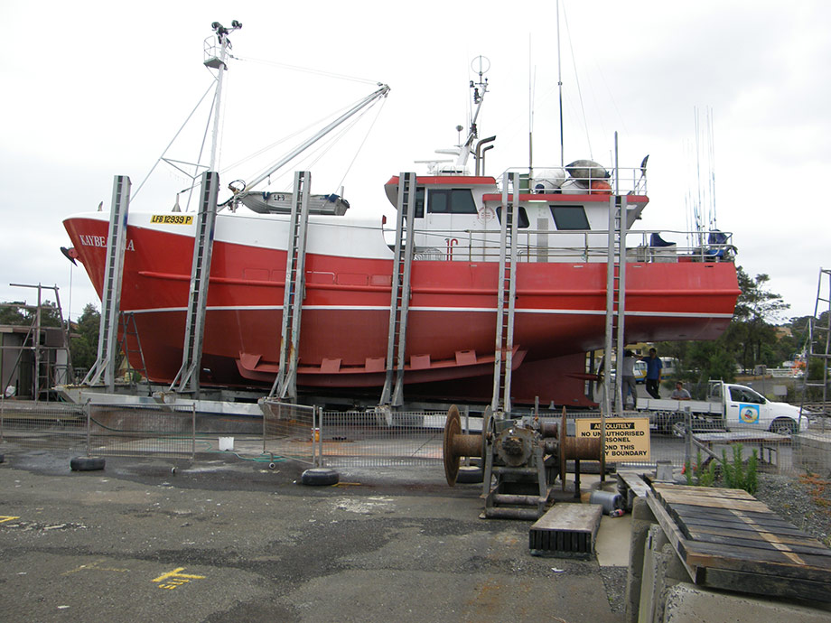 Vessel on slip, red top, red antifoul and white boot line makes vessel very pretty.